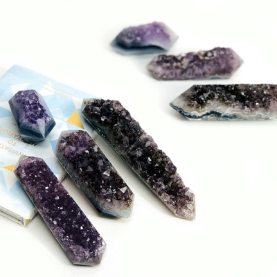 amethyst druzy polished double points on white background
