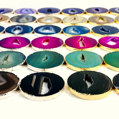 Agate Circle Slice Pendants shown at an angle to show thickness approximation.