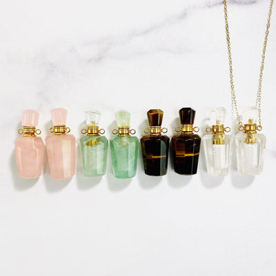 bottle pendant in a row with one on a chain