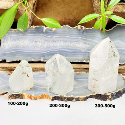 all three semi-polished quartz with chlorite point weight options on display for size comparison