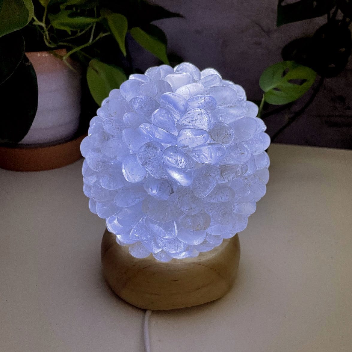 Crystal Quartz tumbled stone lamp, lit with the inserted light