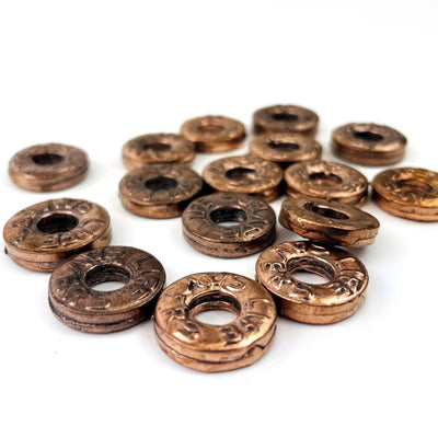 Copper Life Saver Pendants from a side view showing thickness