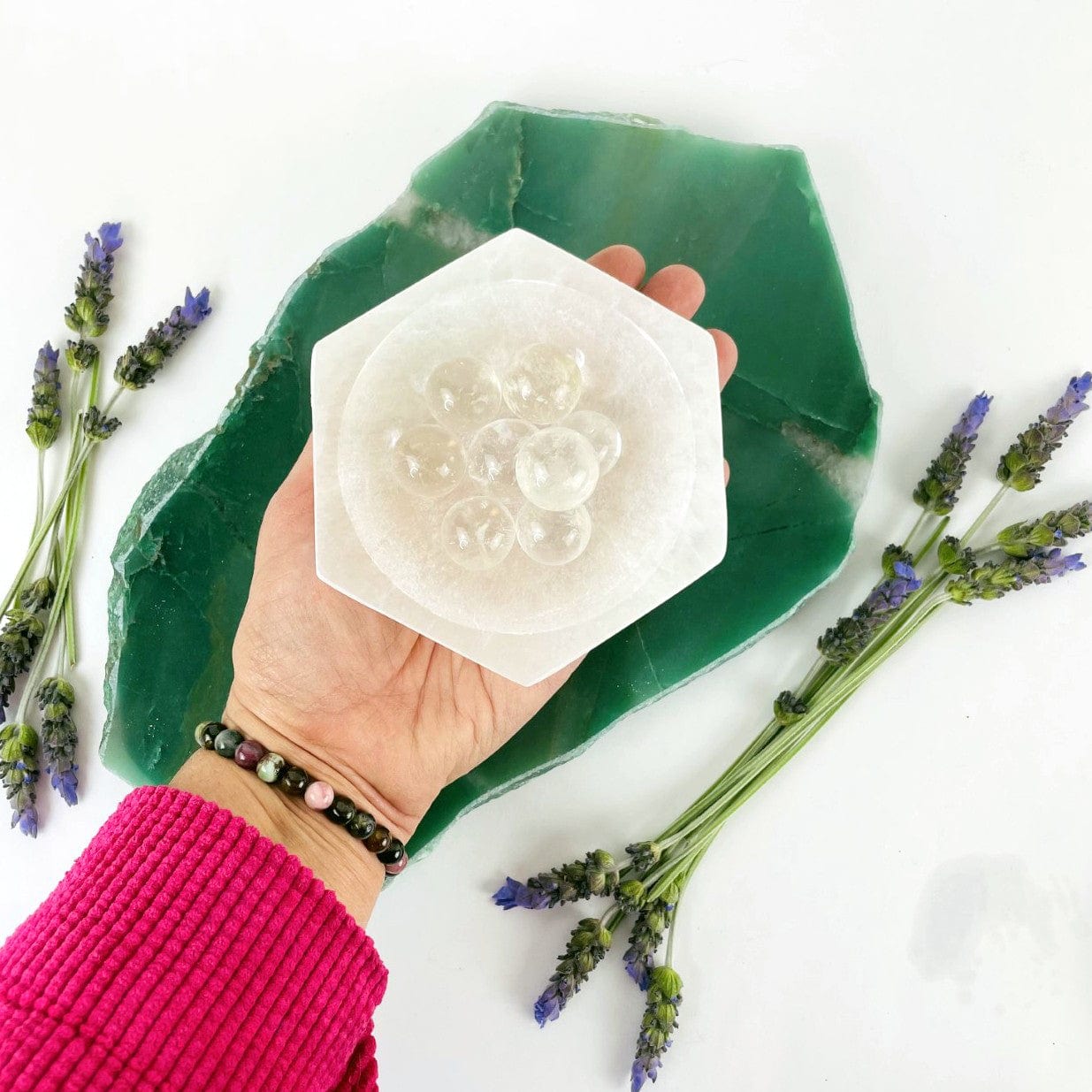 12 cm hexagon selenite bowl in hand for size reference