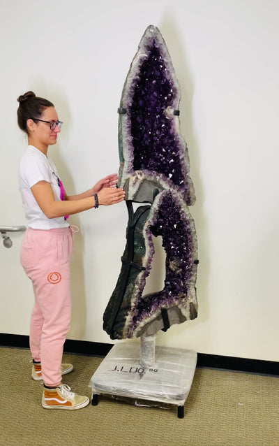 Amethyst Geode Cathedral Stacked Set on metal revolving stand, shown here with woman rotating the piece