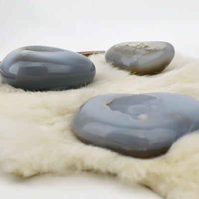 Three Agate Druzy Hearts shown at an angle to show thickness.
