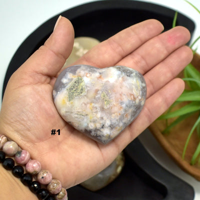 hand holding up Flower Agate Polished Stone Heart