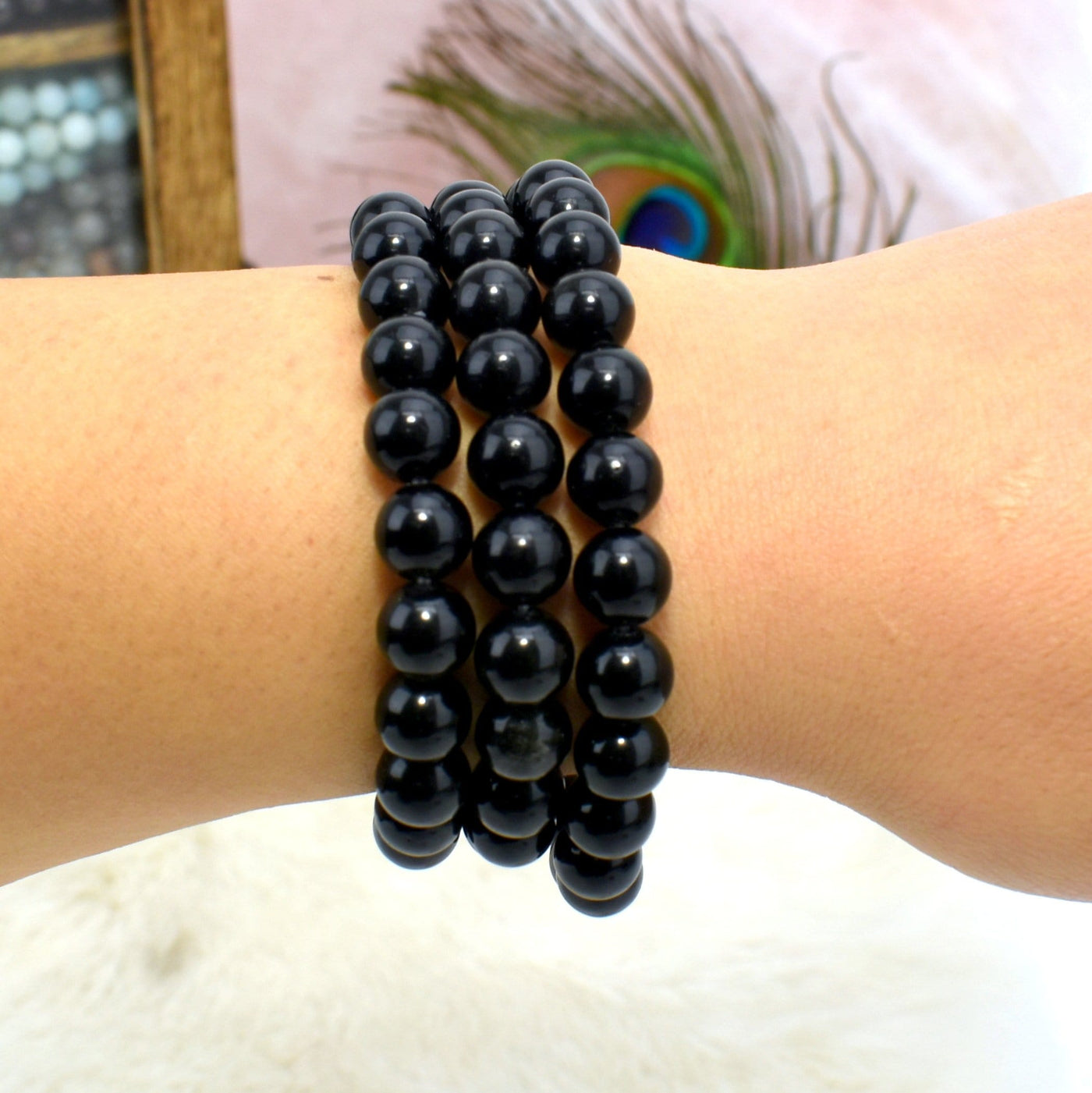 8mm round bead bracelet on wrist for size reference 