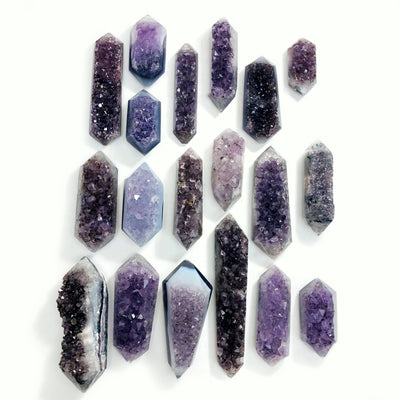 amethyst druzy polished double points on white background