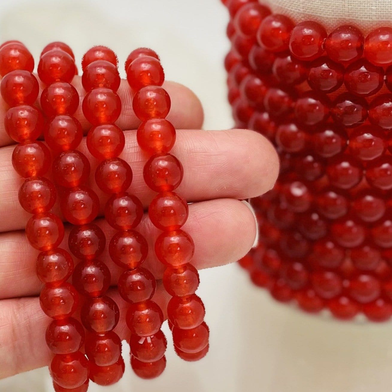 Red Jade Round Bead Bracelet 8mm. These Red Jade bead bracelets are so beautiful and eye catching. They're perfect to use as an accessory or for your meditation time! Also makes a great gift!