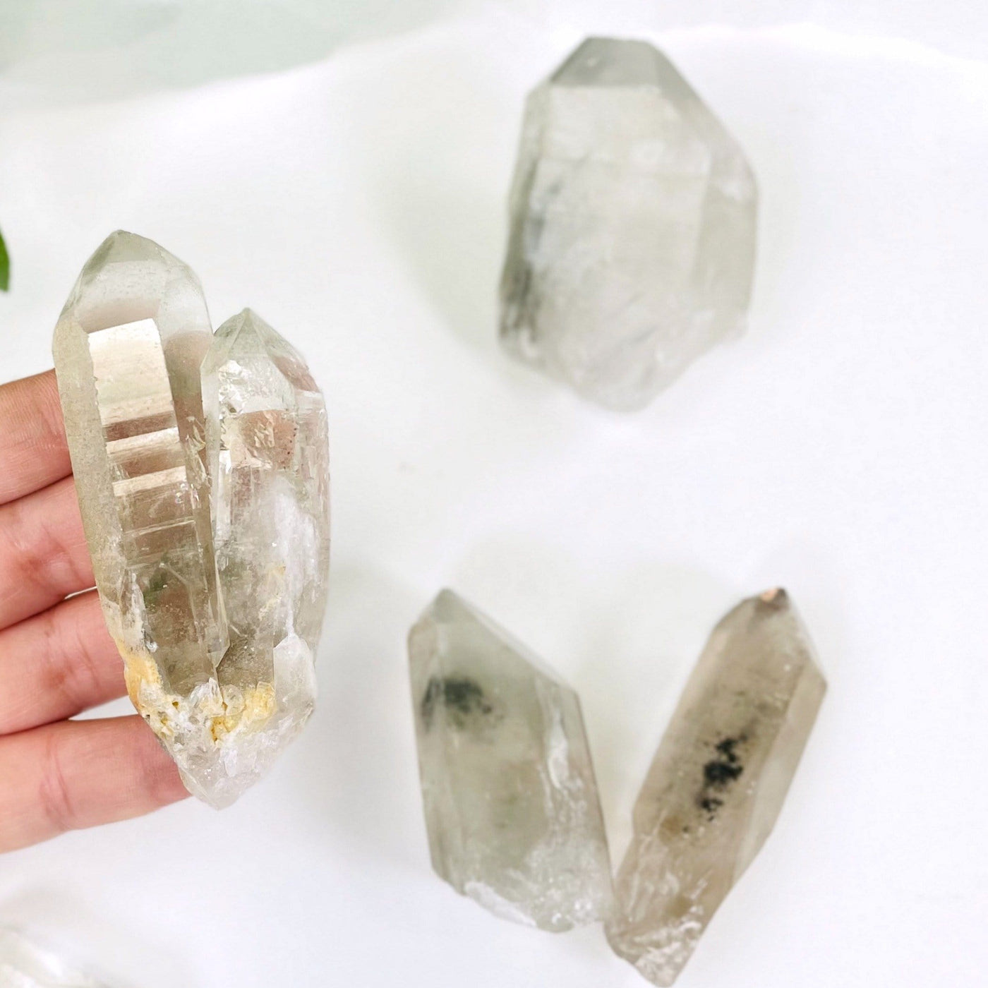 rystal Quartz Point With Chlorite Inclusions - in a hand