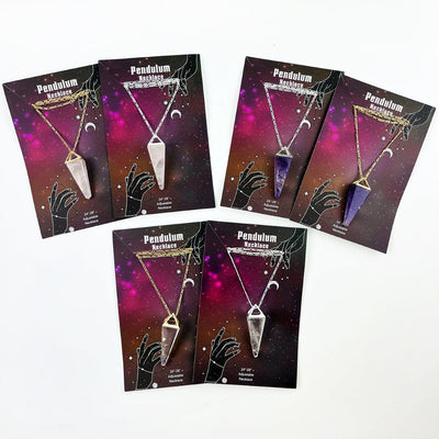 All thge Pendulum necklaces in gold and silver carded