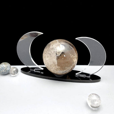 Acrylic Sphere Holder Crescent Moons shown at an angle holding a sphere.