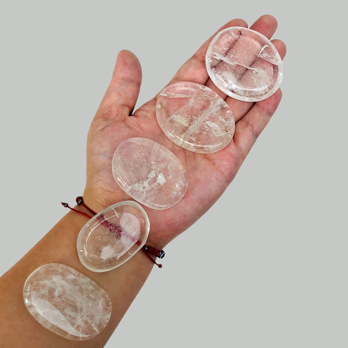 Crystal Quartz Palm Stone in hand for size reference 