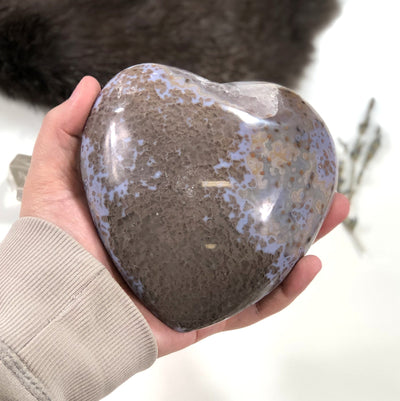 Back side view of Polished Agate Druzy Gray Heart in a hand.