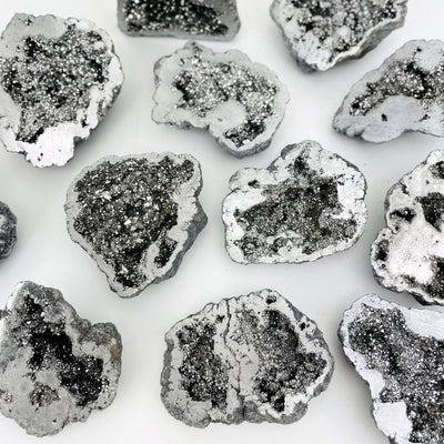 Various platinum Half geodes laid out for size and color reference