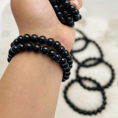 2 black Agate bead bracelets on wrist