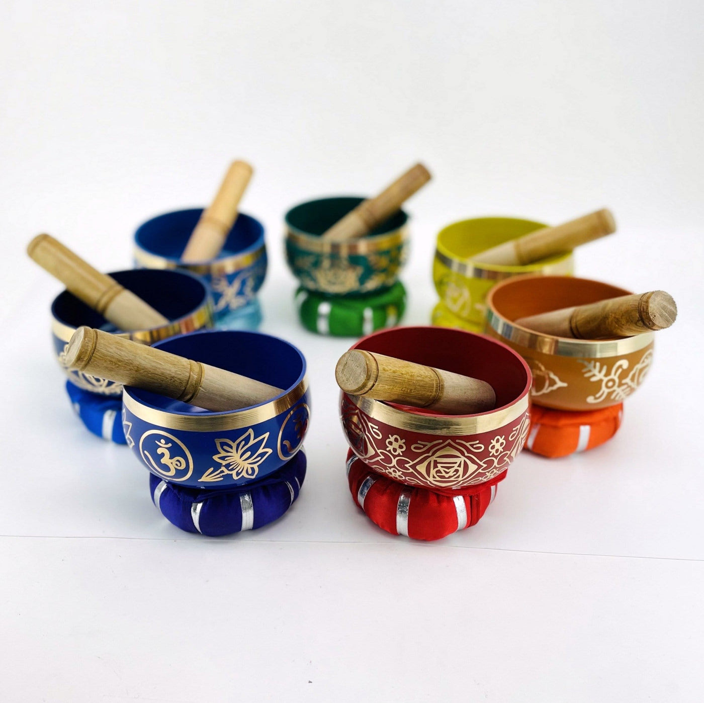 Brass Tibetan Singing Bowls - bowls in a circle with mallets in them