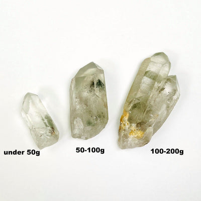 rystal Quartz Point With Chlorite Inclusions - 3 sizes on a table