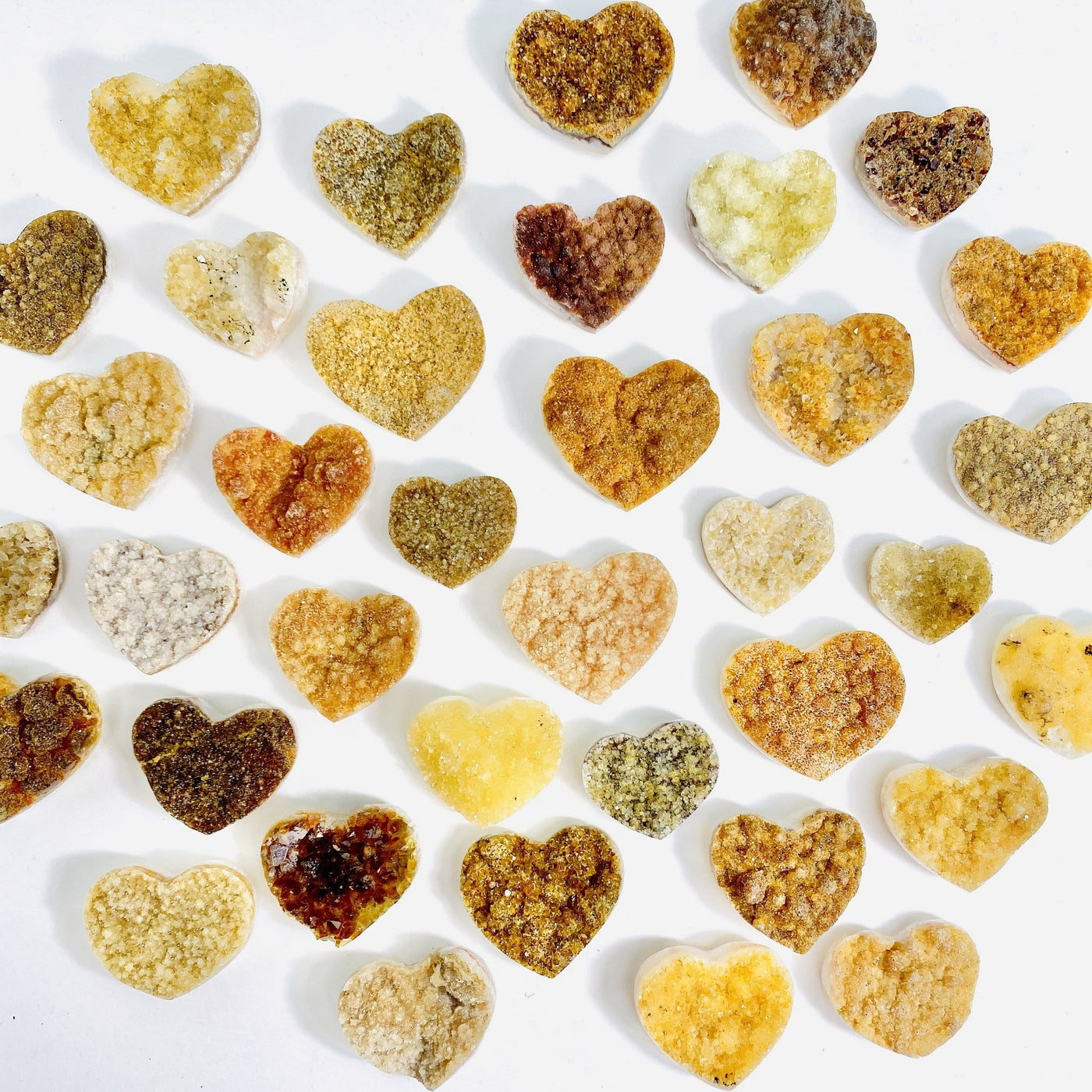 Citrine Cluster Druzy Hearts scattered across white background