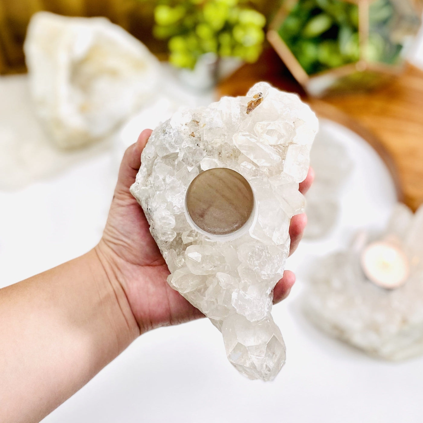 Crystal Quartz Cluster Candle Holder in a hand for size