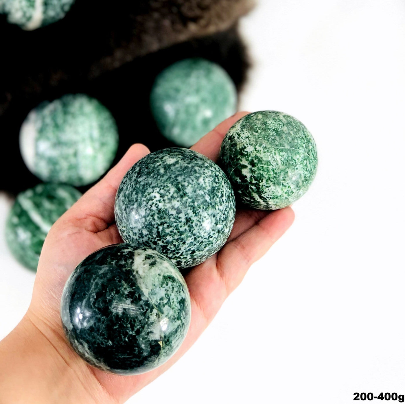 Qinghai Jade Quartz Polished Spheres - view of three jade quartz spheres 
