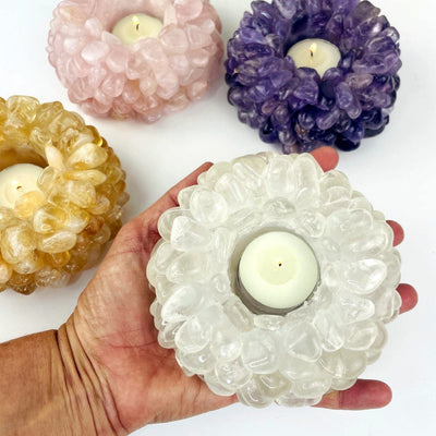 assorted Tumbled Crystal Candle Holder with one in a hand for size reference