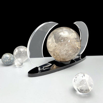 Acrylic Sphere Holder Crescent Moons shown at an angle holding a sphere.