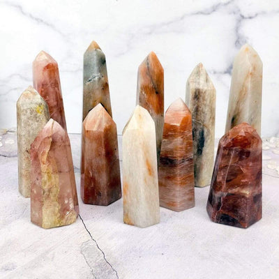 Hematoid Quartz Polished Towers displayed to show various colors shapes size texture and patterns