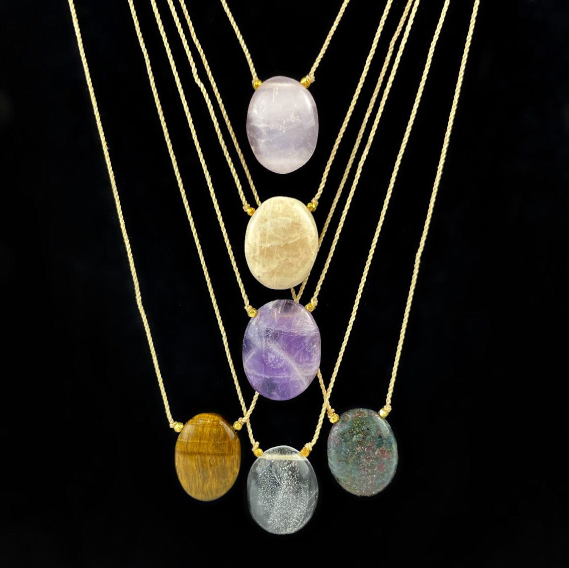 Worry Stone Necklaces hanging on display