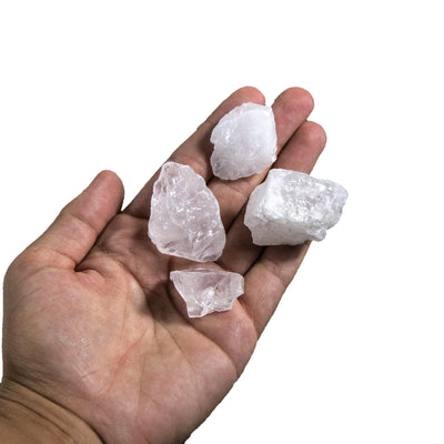 rough crystal stones in a hand