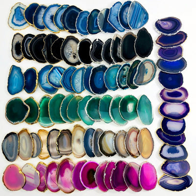 This Picture is showing all the variety of colors we have available for our, agate slices plated edge top drilled. 