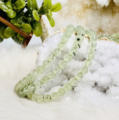 prehnite bracelets on a table