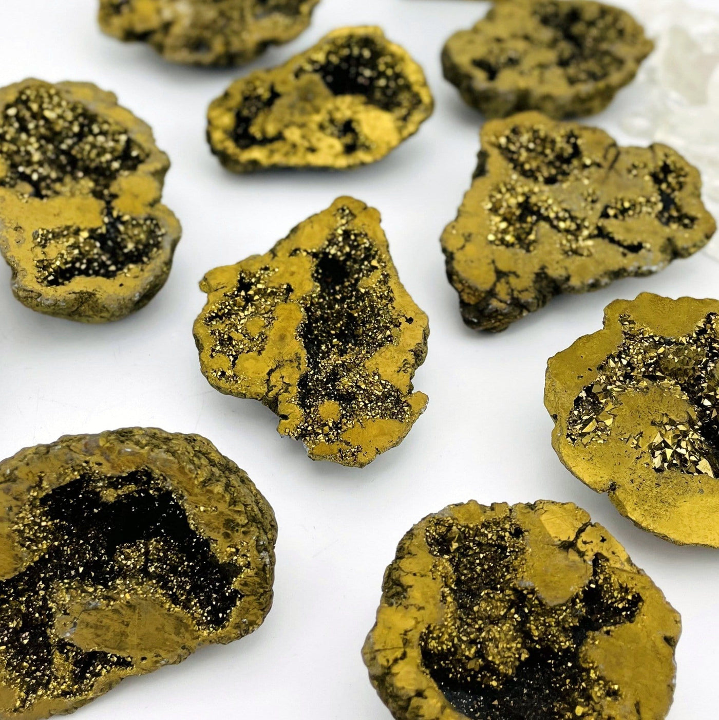 Various Gold Half geodes laid out for size and color reference