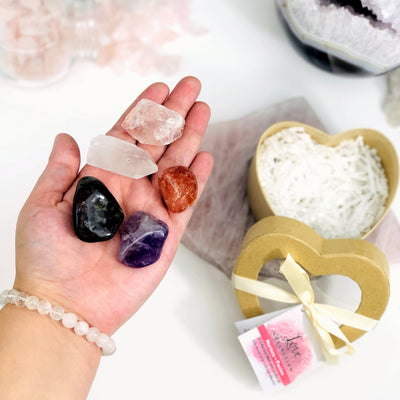 Crystal Healing Love Set of Stones in Heart Shaped Box -stones in a hand