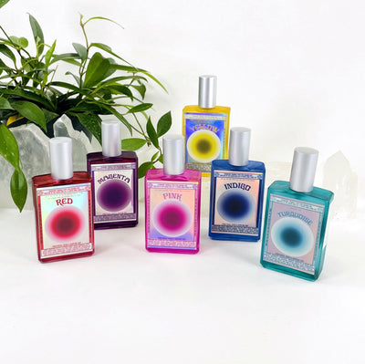 6 different Gemstone Mists with decorations in the background