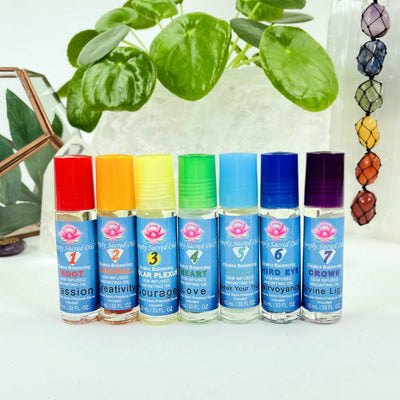 multiple heart chakra balancing oils pictured next to each other