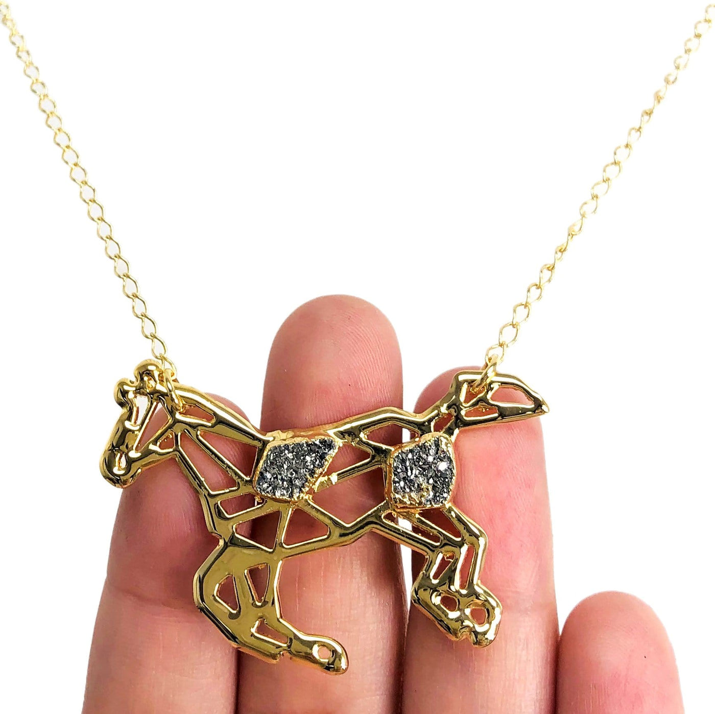 hand holding up Horse Spirit Animal Necklace Adorned with Druzy