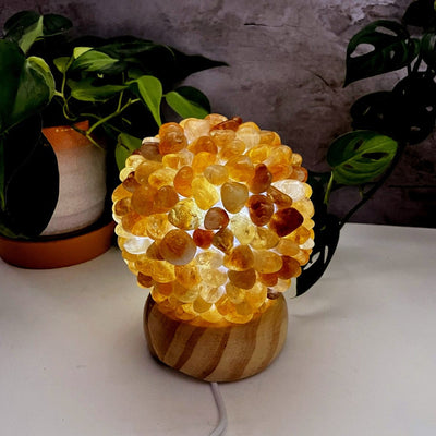 Citrine tumbled stone lamp, lit with the inserted light