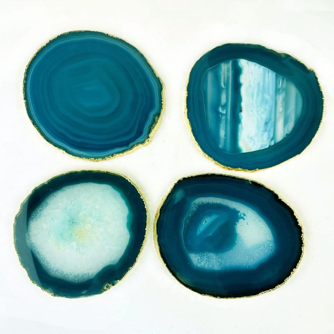 4 Teal Agate coasters with a gold electroplated edge Slices measure about 3.5-5"
