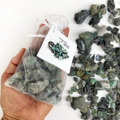 Emerald Stones - Tied & Tagged in an Organza Bag in a hand