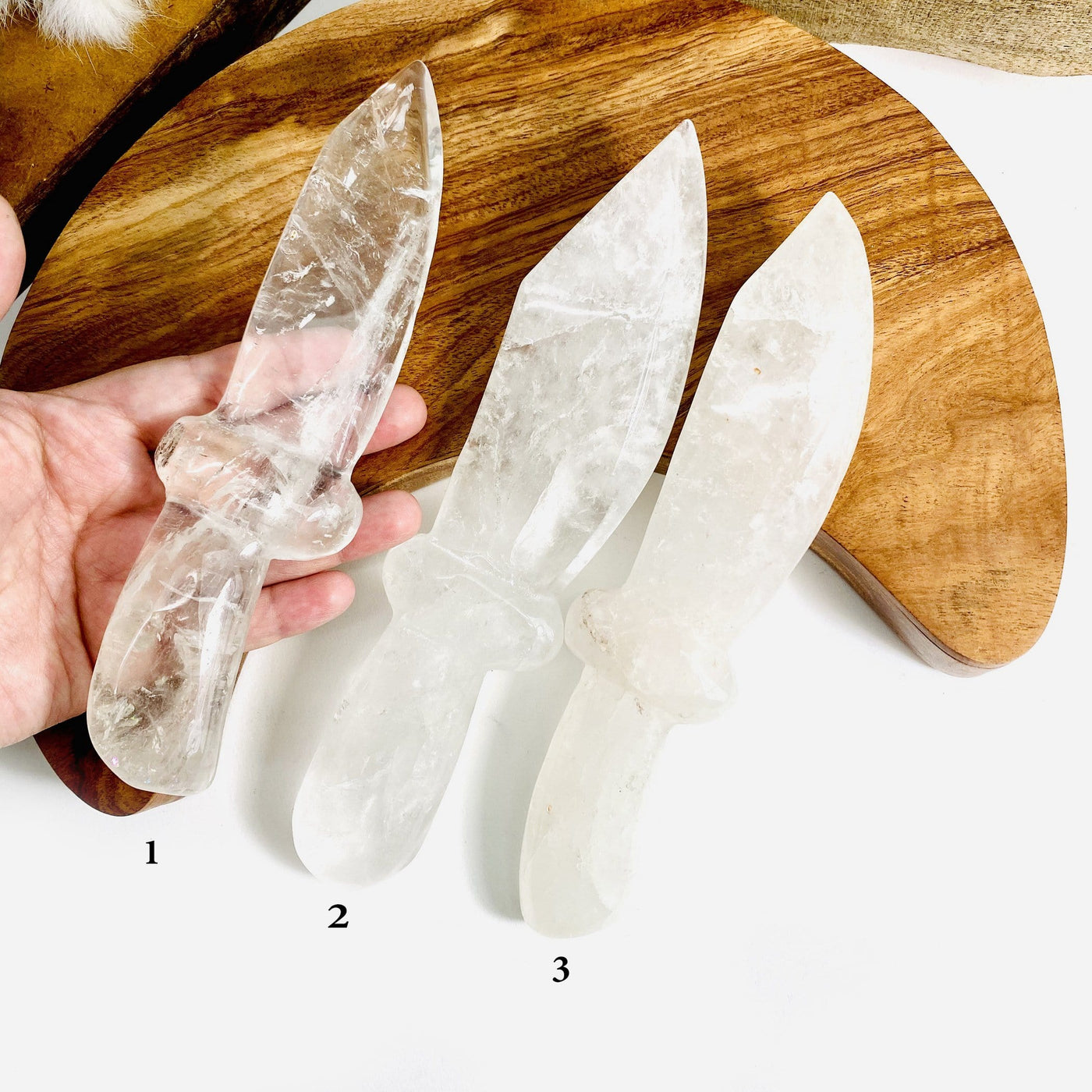 hand holding up option 1 of 3 Crystal Quartz Knifes
