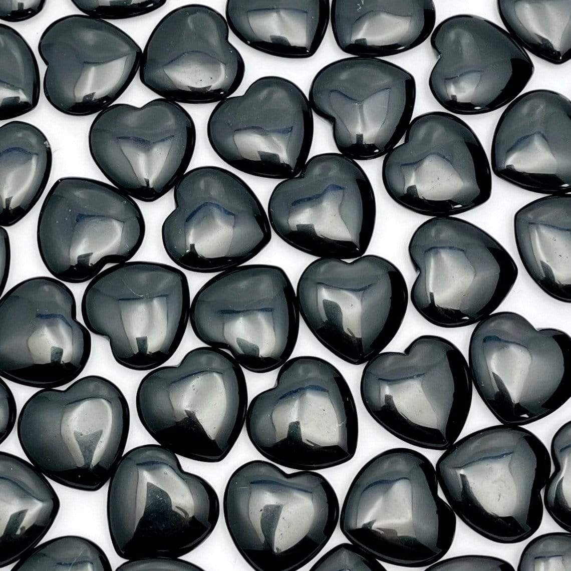 multiple obsidian hearts displayed to show different characteristics in each stone