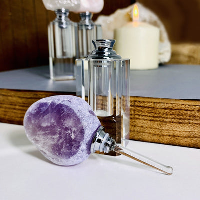 Amethyst perfume Bottle with the top off 