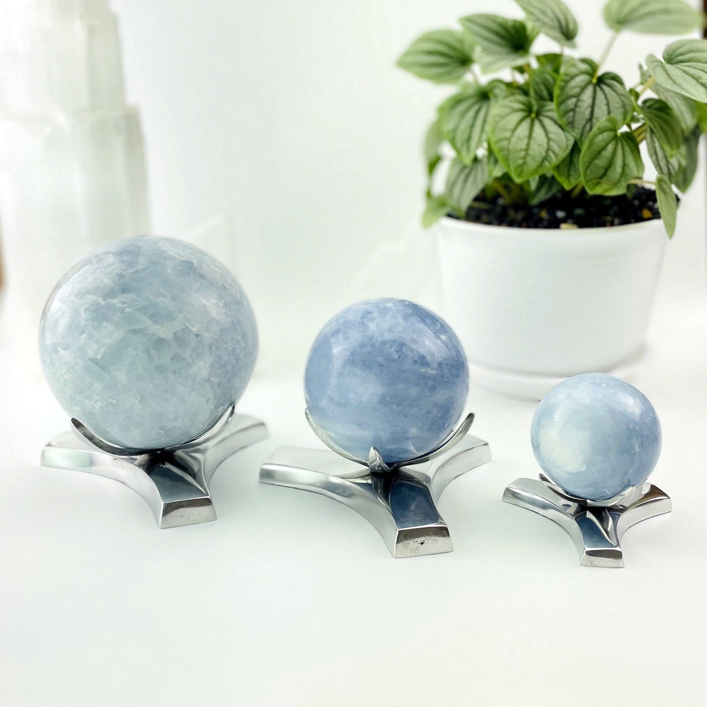 All three size of sphere stands made up as shorter stands with calcite spheres on them to demonstrate the type of crystals they hold.