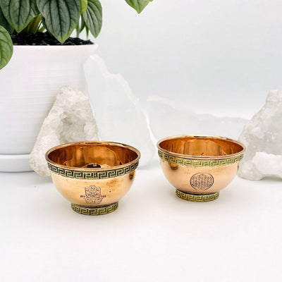copper offering bowls with hamsa hand or flower of life grid emblems