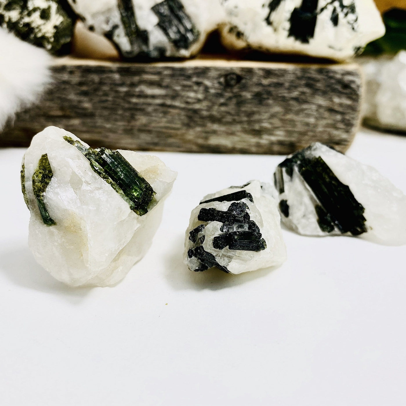 3 different size of Epidote In Quartz Chunks on white background.