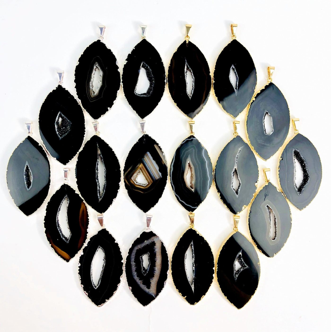 Front facing black agate druzy marquise shape displaying silver and gold pendants. Color and pattern vary.