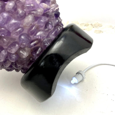 Tumbled Stone Light tipped to show light on bottom