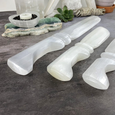 3 sizes of Selenite Knives with Hand Cut and Polished Handles, up close on the handle