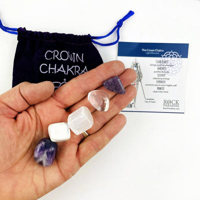Crown Chakra Pouch with information card, and the tumbled stones in a hand